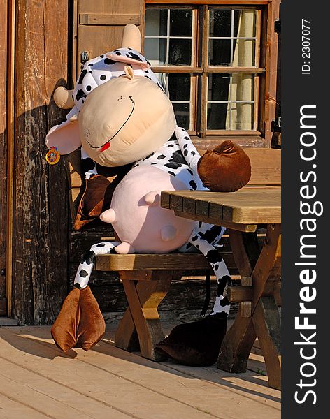 Bavarian cow at the table in restaurant