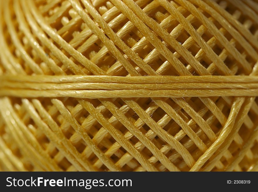 Close up of ball of yellow string. Close up of ball of yellow string
