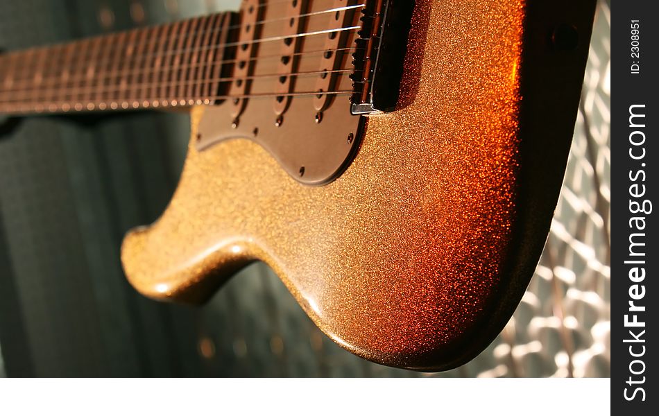 A classic guitar brown guitar on display. A classic guitar brown guitar on display