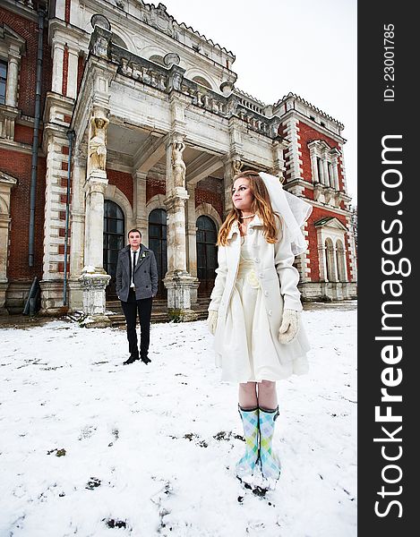 Happy bride and groom on background of castle in wedding day