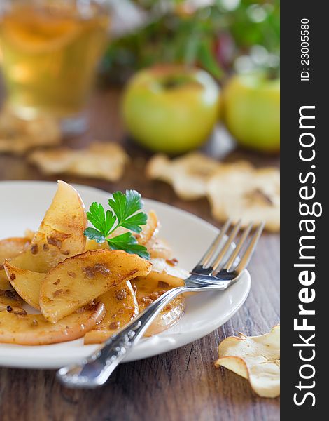 Apples fried with anchovies, selective focus. Apples fried with anchovies, selective focus