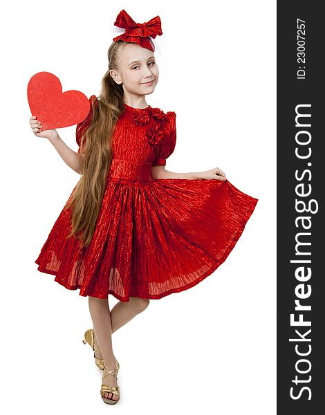 Small playful girl standing with heart in her hands, symbolizing love. Small playful girl standing with heart in her hands, symbolizing love