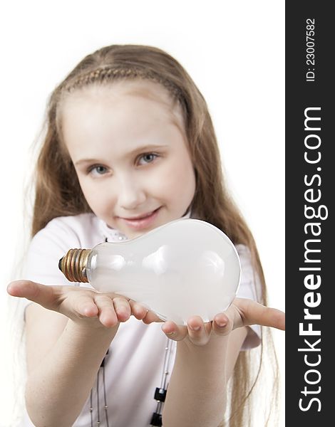 Girl the teenager holds a bulb. Girl the teenager holds a bulb