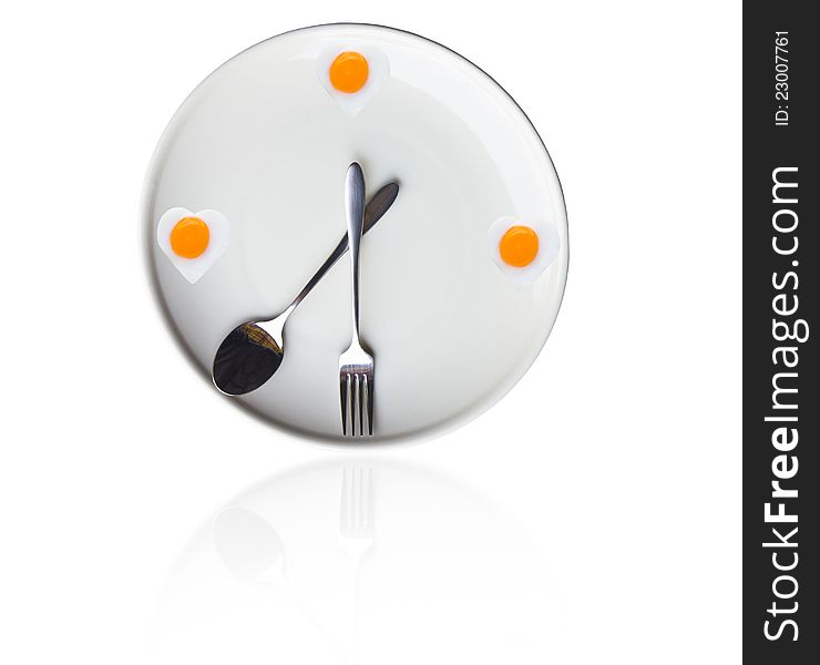 Time for lunch ,Fried egg heart of the clock on the dinner plates. Time for lunch ,Fried egg heart of the clock on the dinner plates.