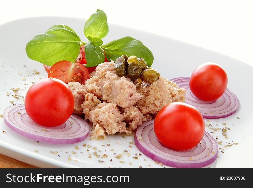 Plate composition whit tuna salad tomato end onion. Plate composition whit tuna salad tomato end onion