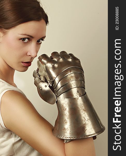 Young woman with steel glove vertical portrait