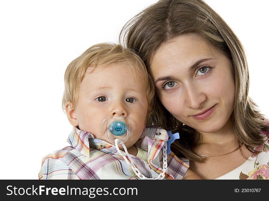 Baby with a dummy in his mouth on hands at mother. Baby with a dummy in his mouth on hands at mother