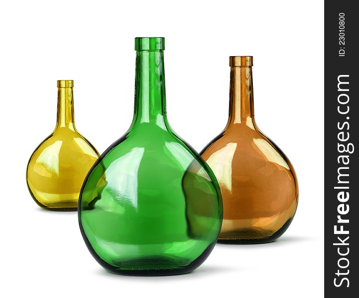 Exotic colorful glass bottles on white background