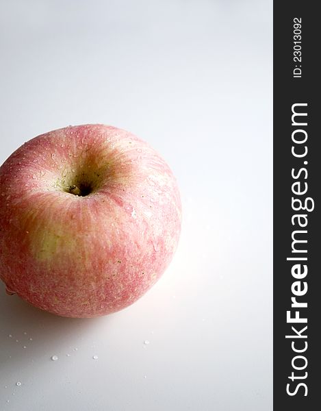 Fresh pink apple on white background