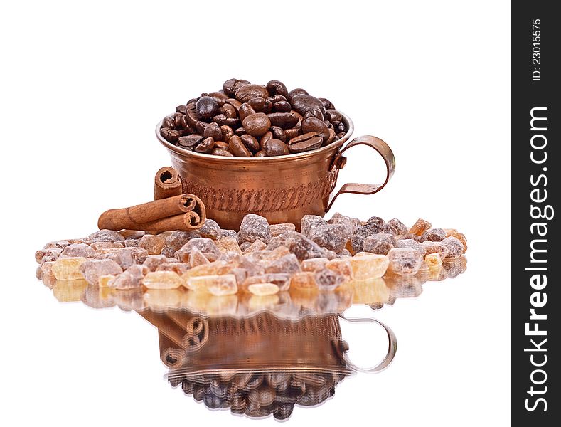 Brown sugar,Coffee beans, coffee cup, cinnamon sticks, white background ,reflection