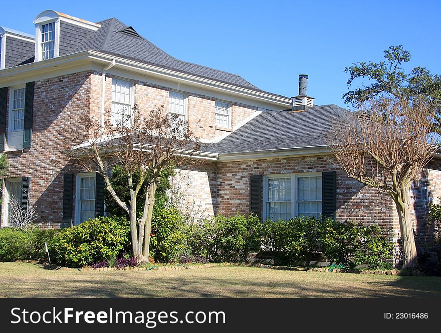 Suburban Brick House With Plants