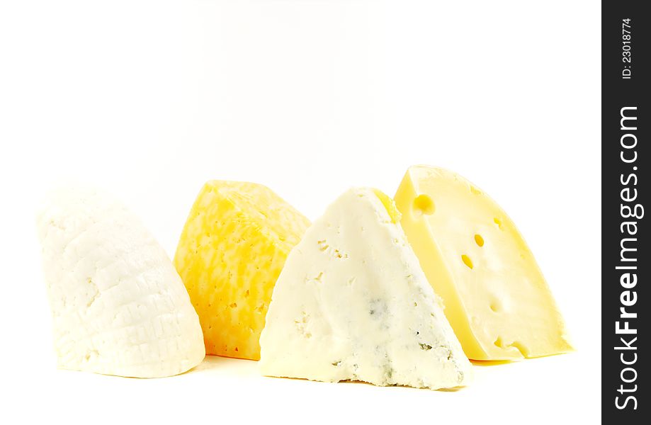Assortment of various types of cheese  on a white background. Assortment of various types of cheese  on a white background