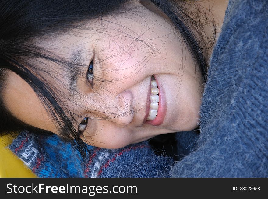 Close up of Asian woman lying down and looking at camera. Close up of Asian woman lying down and looking at camera