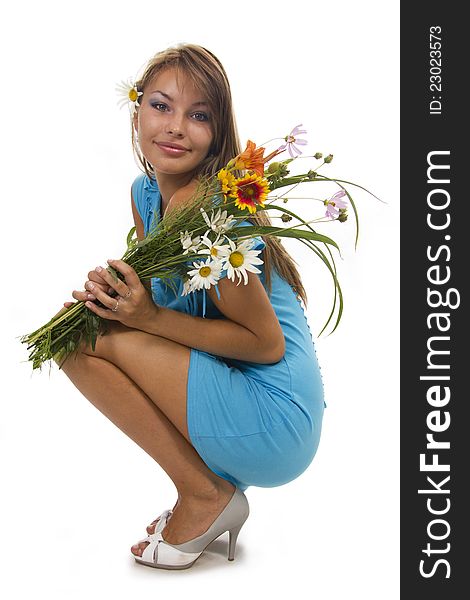 Beautiful girl holds a bunch of flowers, isolated. Beautiful girl holds a bunch of flowers, isolated