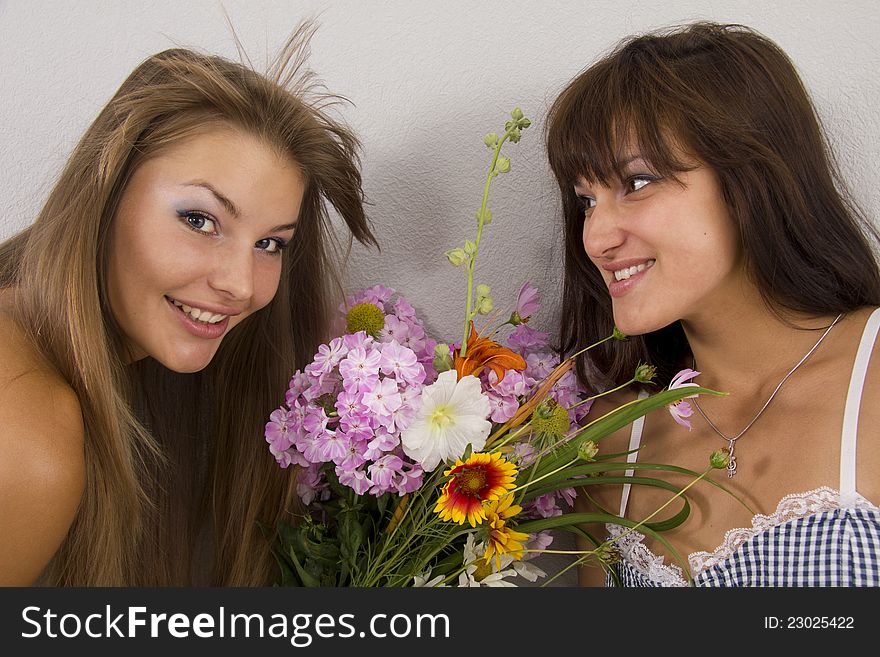 Two girlfriends of different race are happy to be together. Two girlfriends of different race are happy to be together