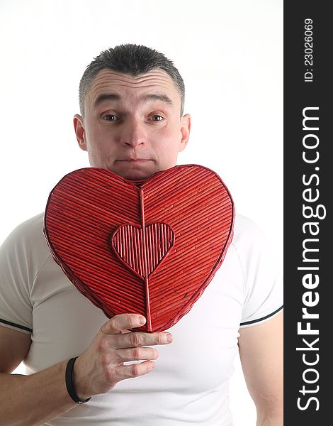 Man with a heart shaped box isolated on white background