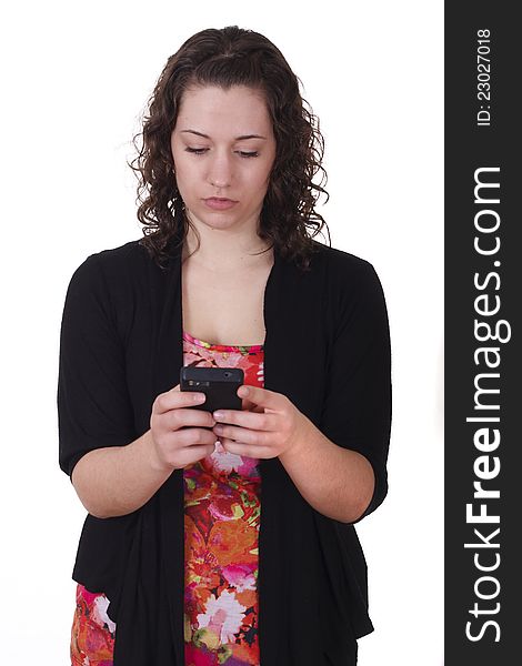 A young woman texting on a cell phone. A young woman texting on a cell phone