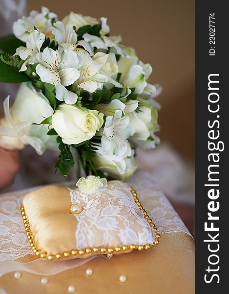 White bridal bouquet and pillow for wedding rings. White bridal bouquet and pillow for wedding rings