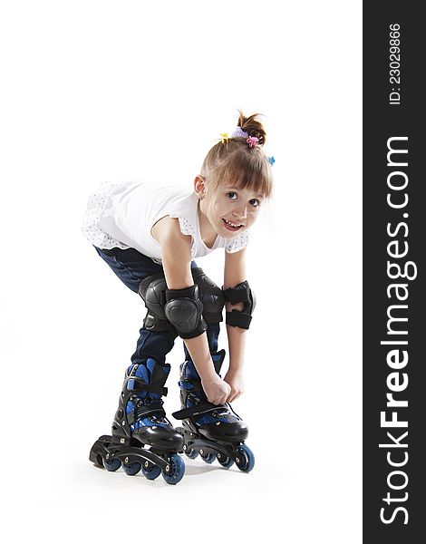 The little girl on roller skates. white