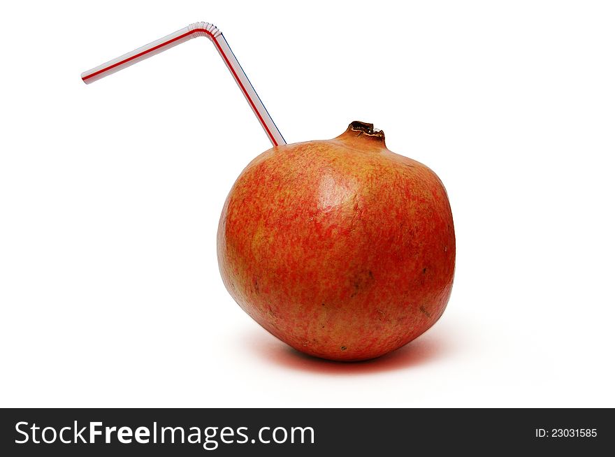 Pomegranate with straw on white. Pomegranate with straw on white