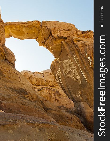 Sandstone natural bridge in the Wadi Rum UNESCO National Heritage site. Sandstone natural bridge in the Wadi Rum UNESCO National Heritage site