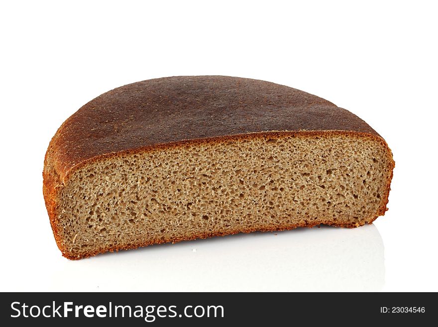 A piece of rye bread on a white background. A piece of rye bread on a white background.