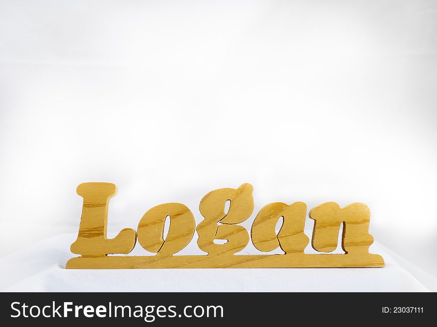 Wooden name plate with the name Logan on it. Wooden name plate with the name Logan on it