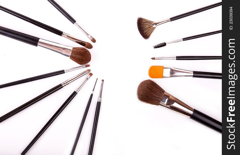 Professional make up and powder brushes on white