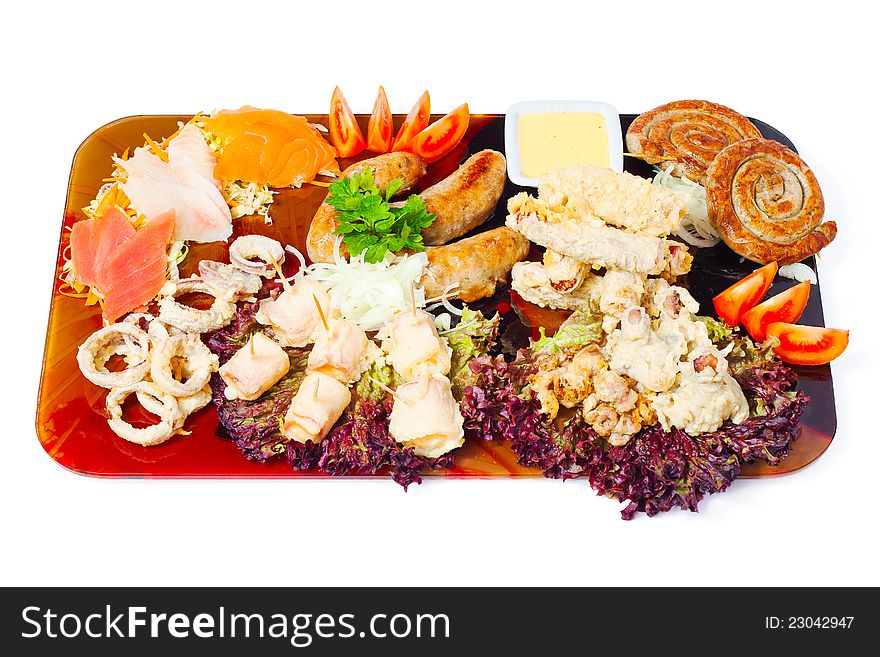 Meat a grill and seafood on a tray on white background
