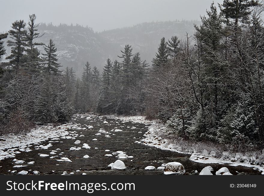 Winter first snow scenery with mountain river in White Mountains, NH