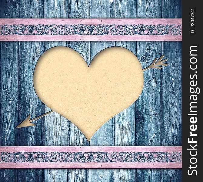 Wooden boards with a hole in the form of heart and a paper for your text behind. A background in style retro. Wooden boards with a hole in the form of heart and a paper for your text behind. A background in style retro.