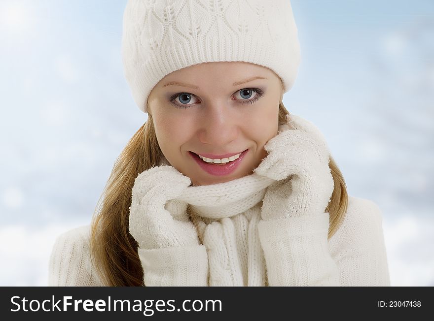 Winter portrait of a beautiful happy girl