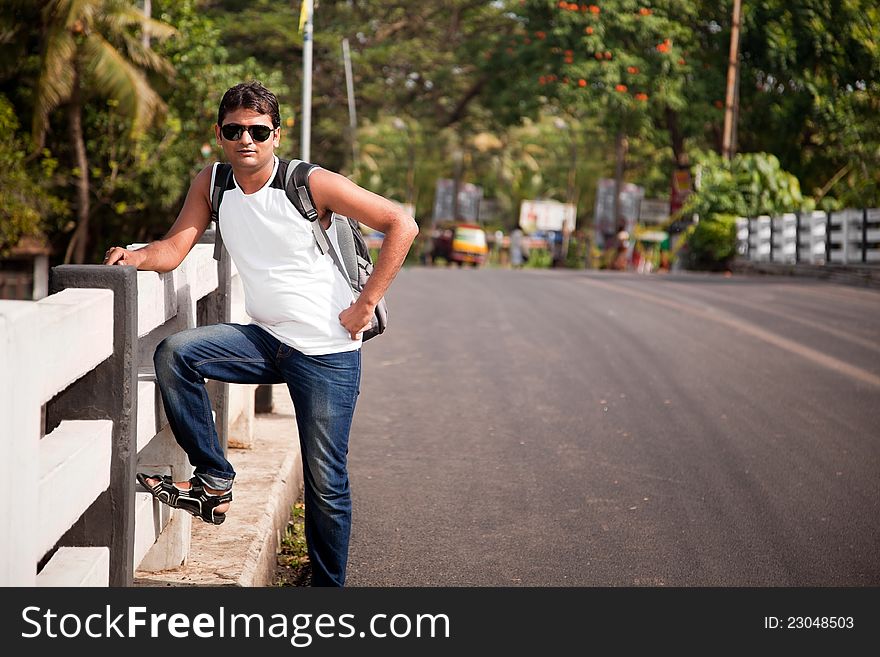 Indian Happy young man with sunglasses, standing. Indian Happy young man with sunglasses, standing