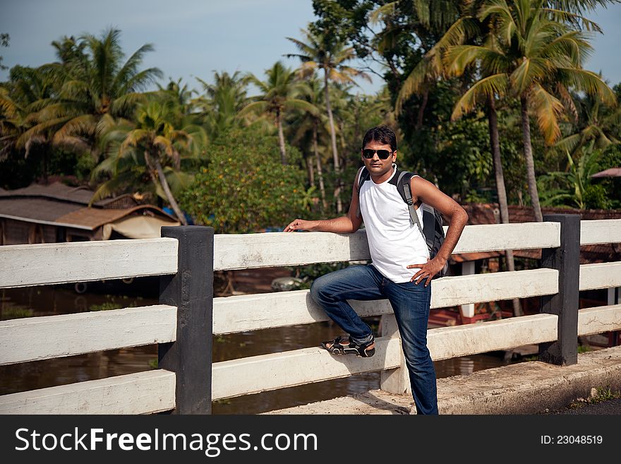 Indian Happy young man with sunglasses, standing. Indian Happy young man with sunglasses, standing