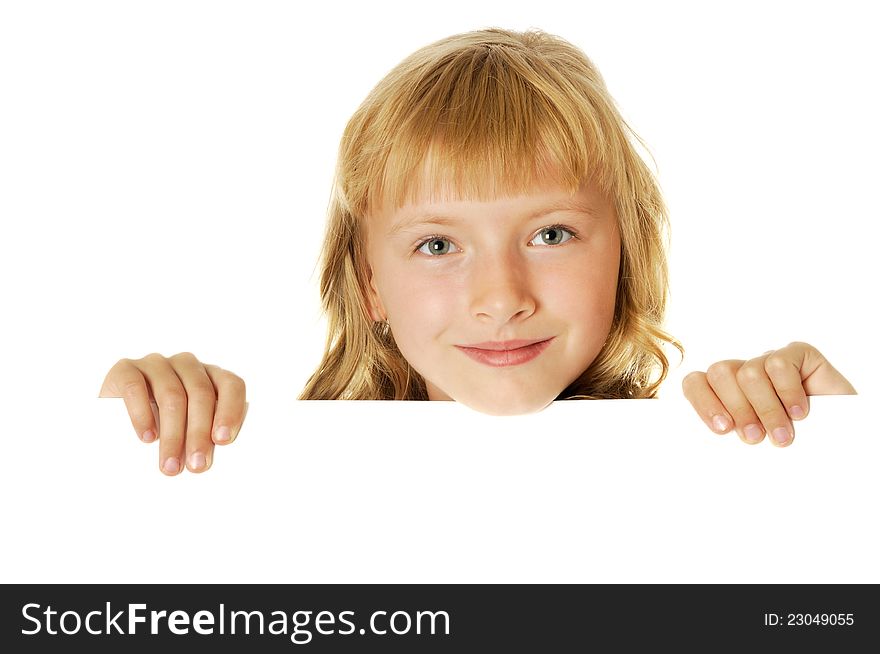 Smiling girl holding white  sheet of a paper, isolated. Smiling girl holding white  sheet of a paper, isolated