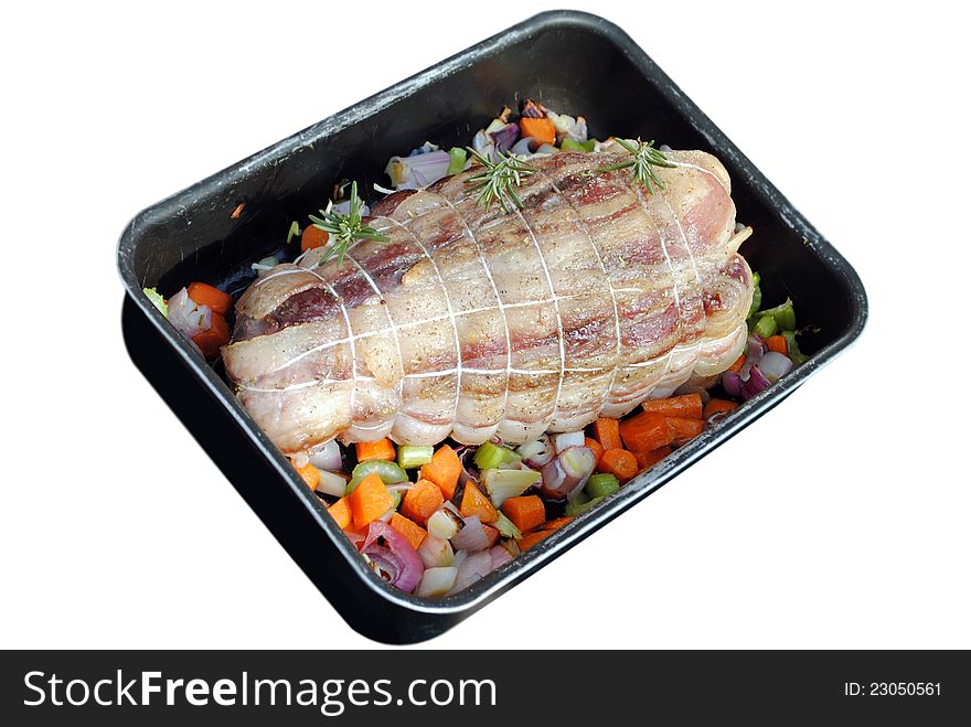 Cooked roast of pork with vegetables in a pan isolated on white. Cooked roast of pork with vegetables in a pan isolated on white