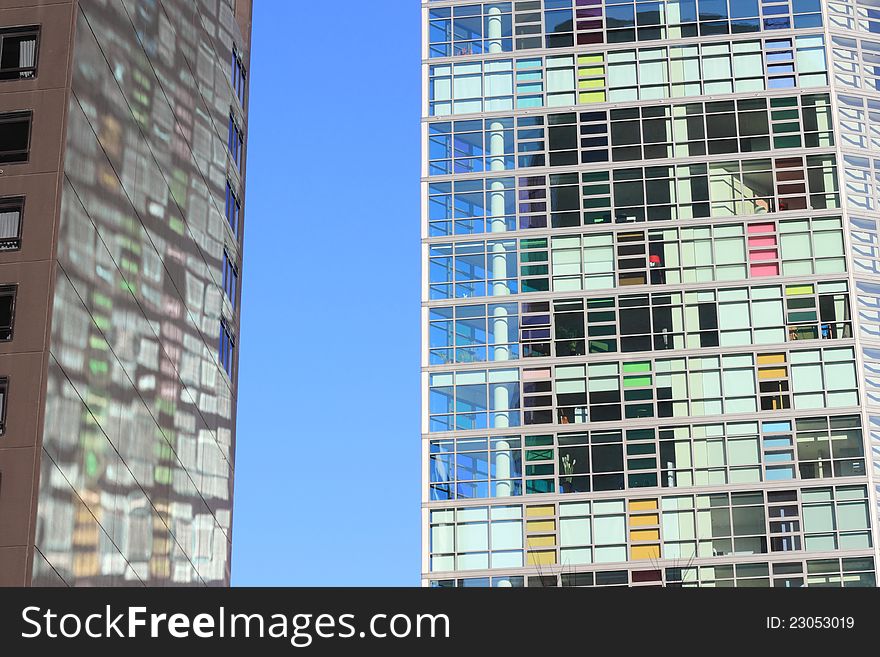 Reflection of the colorful glass front onto the wall of its neighboring skyscraper &#x28;Melbourne, Australia&#x29;. Reflection of the colorful glass front onto the wall of its neighboring skyscraper &#x28;Melbourne, Australia&#x29;