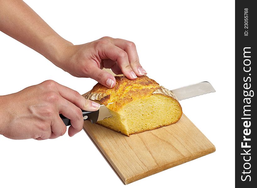 Cutting a loaf of bread on white bacground.