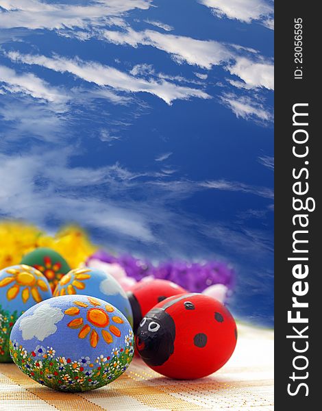 Easter eggs on blue sky background
