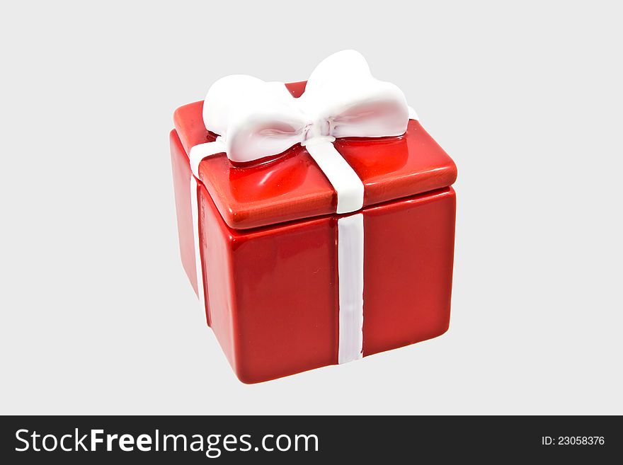 Gift Box With White Ribbon On Gray Background