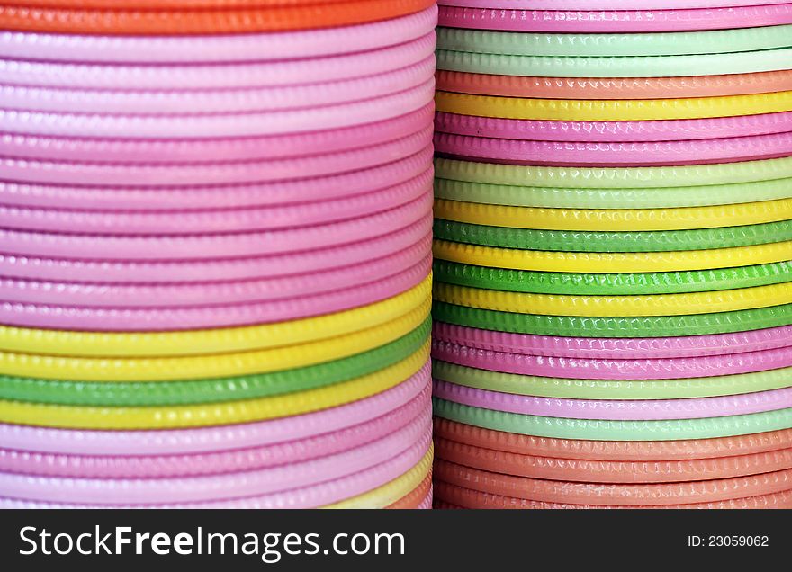 Plates of various colors piled on one above the other. Plates of various colors piled on one above the other