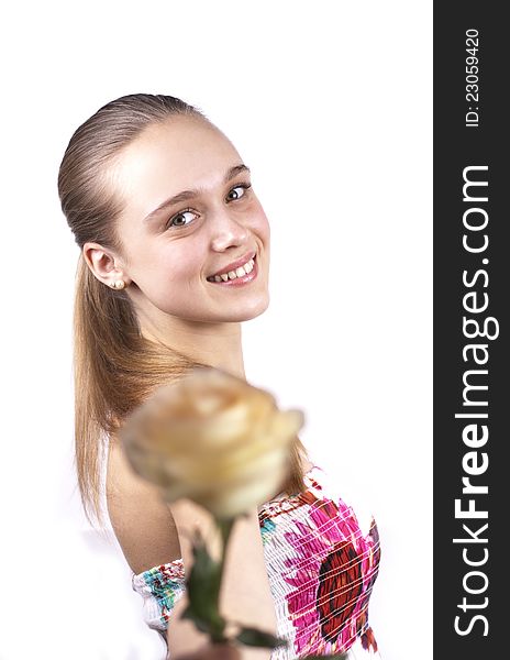 Young cute woman with a flower isolated on a white background