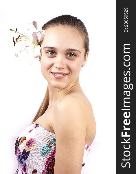 Young happy beautiful woman with flower on white background