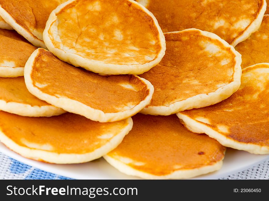 Pancakes on a plate closeup. Pancakes on a plate closeup