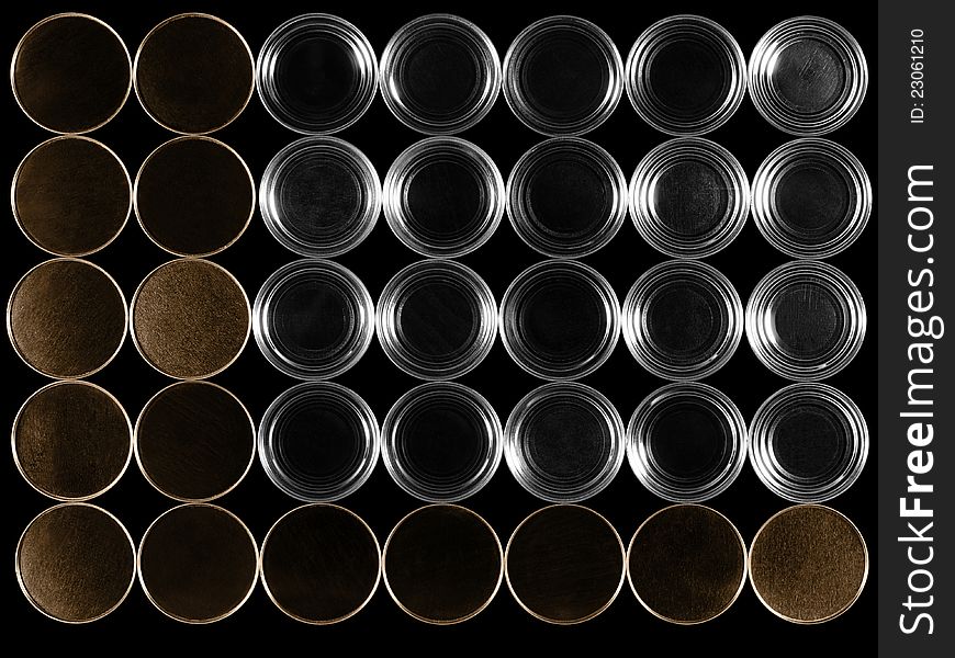 Bottoms of cans on a black background.