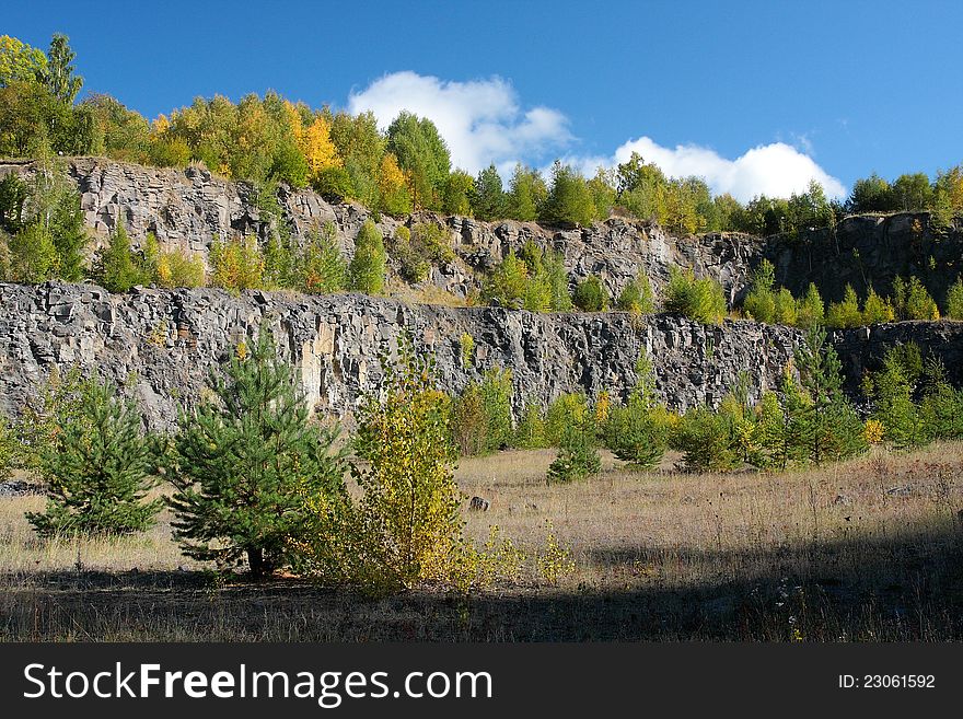 Old basalt quarry with trees. Old basalt quarry with trees