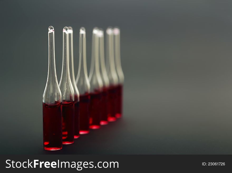 Medical ampoules on a black background close up