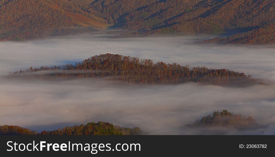 Mist covered Appalachian mountains, in North Carolina in autumn, at sunrise. Mist covered Appalachian mountains, in North Carolina in autumn, at sunrise