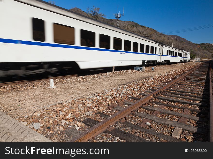 Fast train starting from the railway station. Beijing, China.