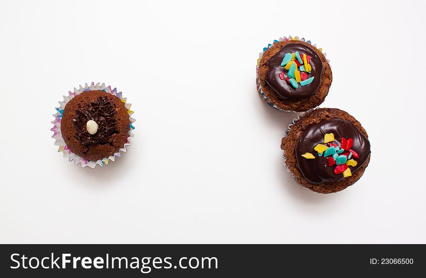 Three muffins one different from the other two on white background